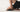 Person wearing black Birkenstock Big Buckle sandals in a minimal lifestyle setting